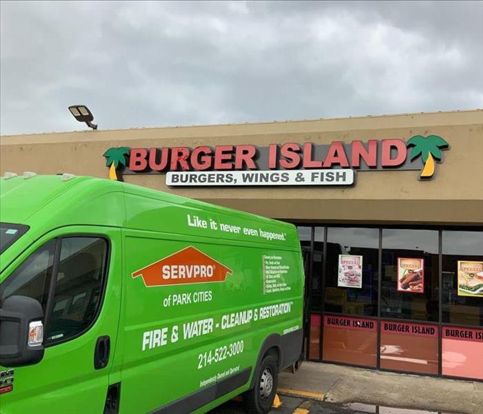 A Servpro van preparing for work outside of a local burger joint. 