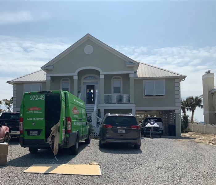 SERVPRO van parked outside a beach house in Alabama preparing to start a job.