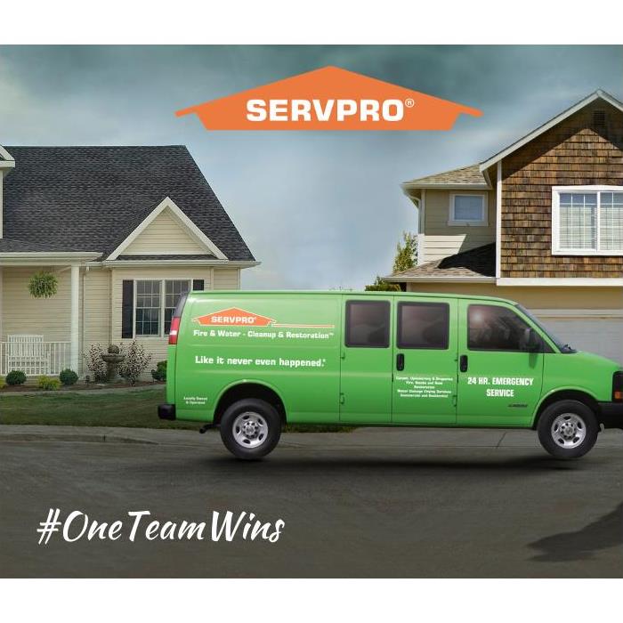House with SERVPRO van in front.